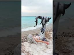 A playful Mermaid Phantom plays with her tail on a winter day