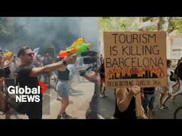 Thousands participate in anti-tourism protest in Barcelona with water pistols, smoke bombs